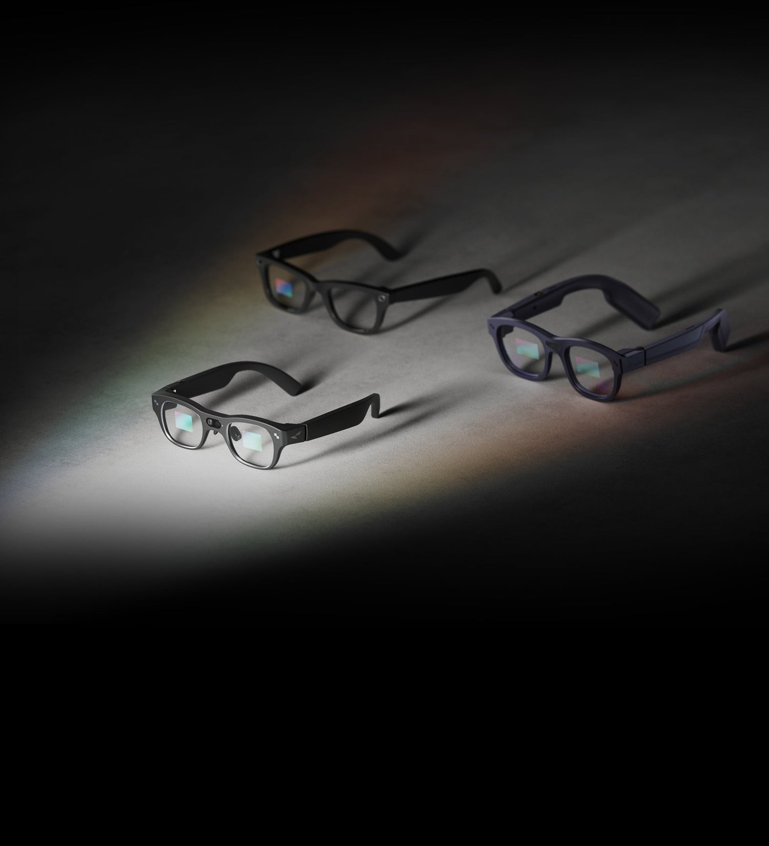 Three RayNeo ai-powered smart glasses display glowing virtual screens in low light.